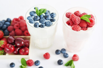 Yogurt cocktail and parfait. Natural detox. Liquid ice cream. Healthy food and breakfast. Good morning. Berry Milk Smoothie with blueberries, strawberries, raspberries. Fresh diet dessert. Summer card