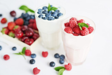 Yogurt cocktail and parfait. Natural detox. Liquid ice cream. Healthy food and breakfast. Good morning. Berry Milk Smoothie with blueberries, strawberries, raspberries. Fresh diet dessert. Summer card
