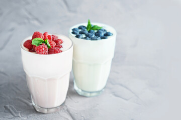 Yogurt cocktail and parfait. Natural detox. Liquid ice cream. Healthy food and breakfast. Good morning. Berry Milk Smoothie with blueberries, strawberries, raspberries. Fresh diet dessert. Summer card
