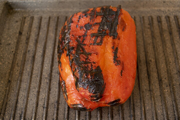 roasting red pepper on a griddle