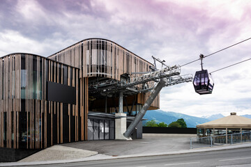 valley station of modern ropeway with gondola with cloudy sky in tirol mountains