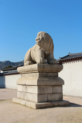 Fototapeta na wymiar Mythological lion Haechi statue at Gyeongbokgung Palace gate in Seoul, South Korea