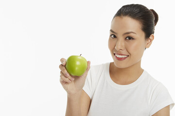 Woman with a green apple