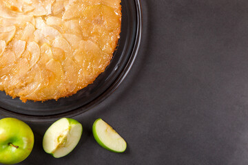 Homemade apple pie on a stone countertop. Appetizing breakfast, author's recipe.