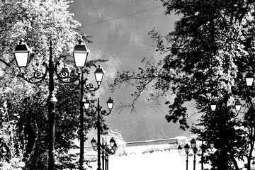 gas lanterns down to the river in black and white representation