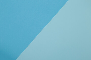 Blue background, colored paper geometrically divides into zones, frame, copy, space.
