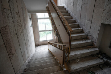 Interior of staircase of an abandoned building in the style of Soviet brutalism of the 80s, lined...