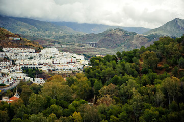 Cityscape of european Malaga city in Spain with cloudy sky in spring day on May.