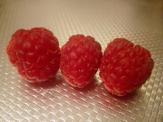 raspberries on a white background