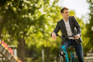 Young businessman on the ebike