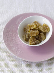Stem ginger in white bowl pink plate