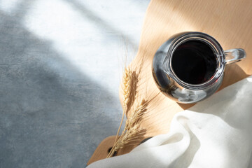 jug of kvass, spikelet on a gray background