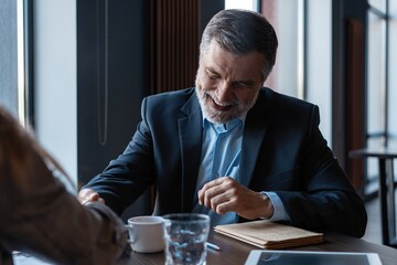 Happy recruiting manager congratulating female vacancy candidate, shaking hand. New job concept