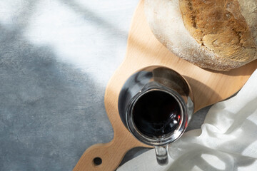 a glass of kvass, rye bread on a gray background