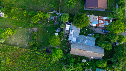 Fototapeta na wymiar Aerial view of countryside landscape - Ukraine. Photography of roofs in village.