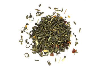 green tea loose leaf with fruit slices isolated on white