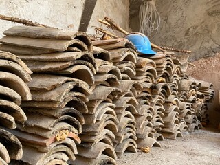 A construction site in Finestrat-Spain. A blue helmet of a construction worker placed on a heap of...