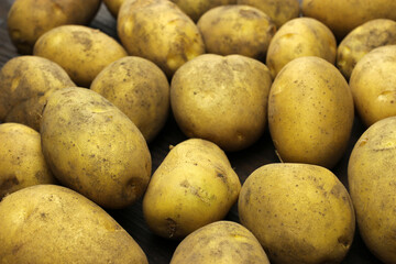Raw organic potatoes, background, texture