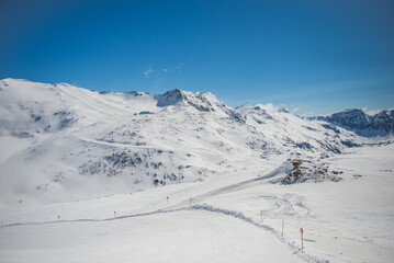 Spring alp scenery from Molltal glacier. Ski slope with skier in foggy april day.