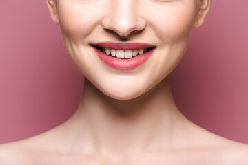 cropped view of happy young woman with lipstick on lips on pink