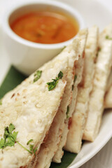 Garlic naan bread with curry dip