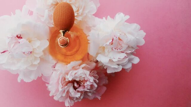 Citrus perfume bottle with peony flowers, chic fragrance scent as luxury cosmetic, fashion and beauty product backgrounds