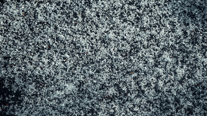 Rare snow lies in a thin layer on the surface of the earth