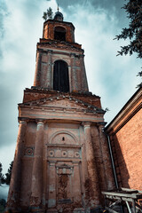 Bell tower of the old stone Church from the lower angle