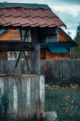 An old wooden well with a small roof