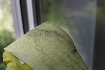 Dirty rag sponge from a wiped window. Dirt on the Windows. Window cleaning.