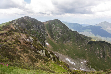 Landscape view of summer mountains with rocks and snow. Carpathians, Marmaroshchyna, Maramures, Ukraine