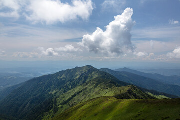 Clouds over the summer mountain view. Travel outdoor concept view of dramatic sky