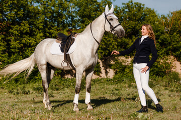 Obraz na płótnie Canvas Beautiful white horse and teenage girl