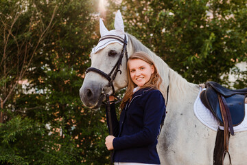 portrait of a teenage girl next to a white horse