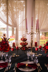 Romantically decorated table for a special event. Red decoration for celebration