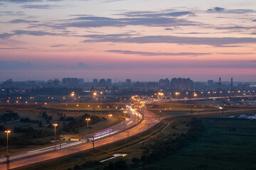 city ​​lights and road at dusk