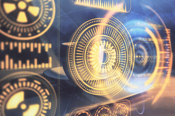 Computer on desktop in office with technology theme hologram. Double exposure. Tech concept.