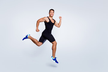 Fototapeta na wymiar Full length body size view of nice attractive strong sportive muscular cheerful cheery proud guy jumping running goal cup champion sprinter isolated over light gray pastel color background