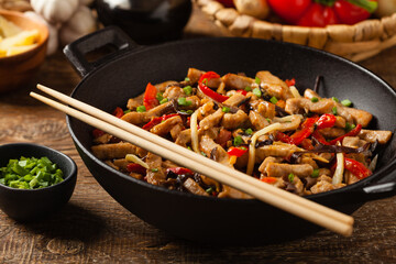Pork chop with peppers, mushrooms and bamboo. Served with rice.
