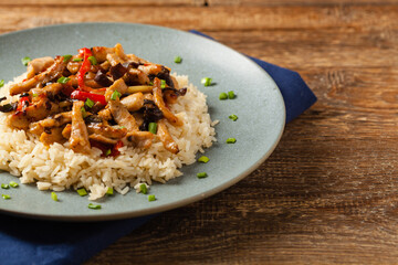 Pork chop with peppers, mushrooms and bamboo. Served with rice.