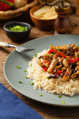 Pork chop with peppers, mushrooms and bamboo. Served with rice.