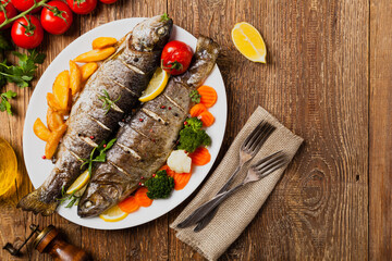 Grilled whole trout. Served with baked potatoes.