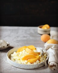 Fresh homemade cottage cheese with sour cream and apricots, breakfast, still life