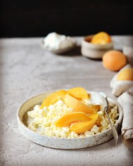 Fresh homemade cottage cheese with sour cream and apricots, breakfast, still life