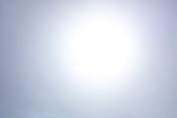 Shining sun at clear blue sky.