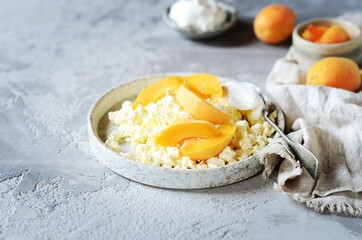 Fresh homemade cottage cheese with sour cream and apricots, breakfast, still life