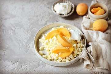 Fresh homemade cottage cheese with sour cream and apricots, breakfast, still life