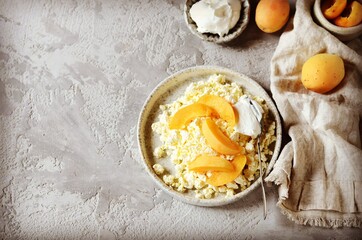 Fresh homemade cottage cheese with sour cream and apricots, breakfast, still life