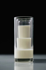 Three glasses of milk with different amount