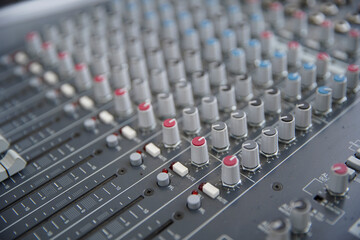 Sound amplifier and equalizer studio mixer control panel for sound recording. Selective focus.